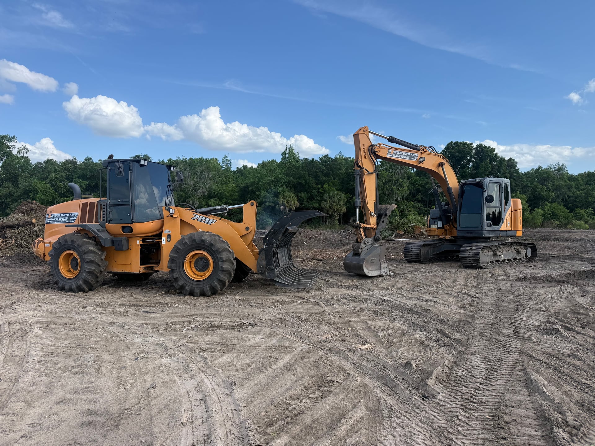 Case wheel loader and excavator on a prepped Central Florida site ready for construction