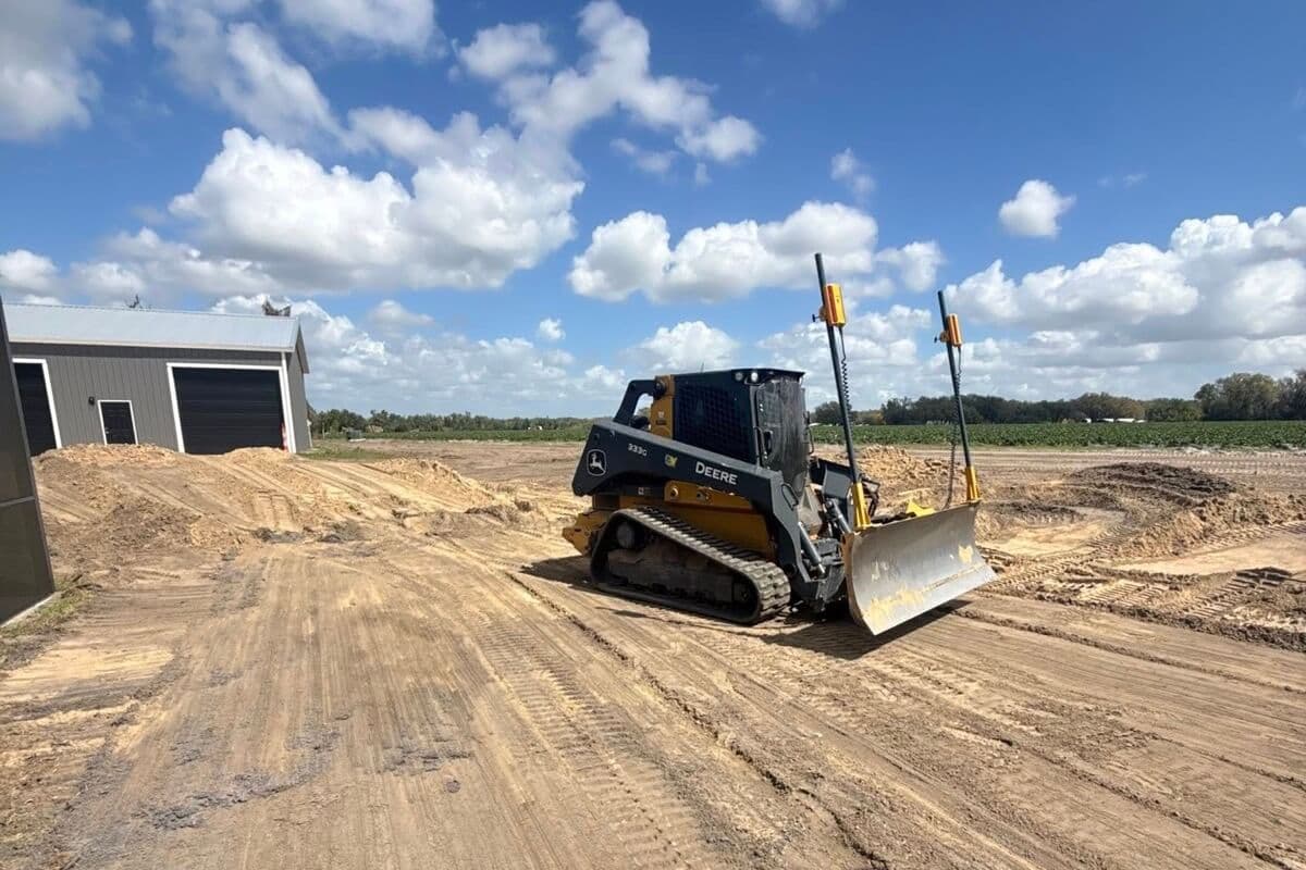 Heavy equipment actively grading a property